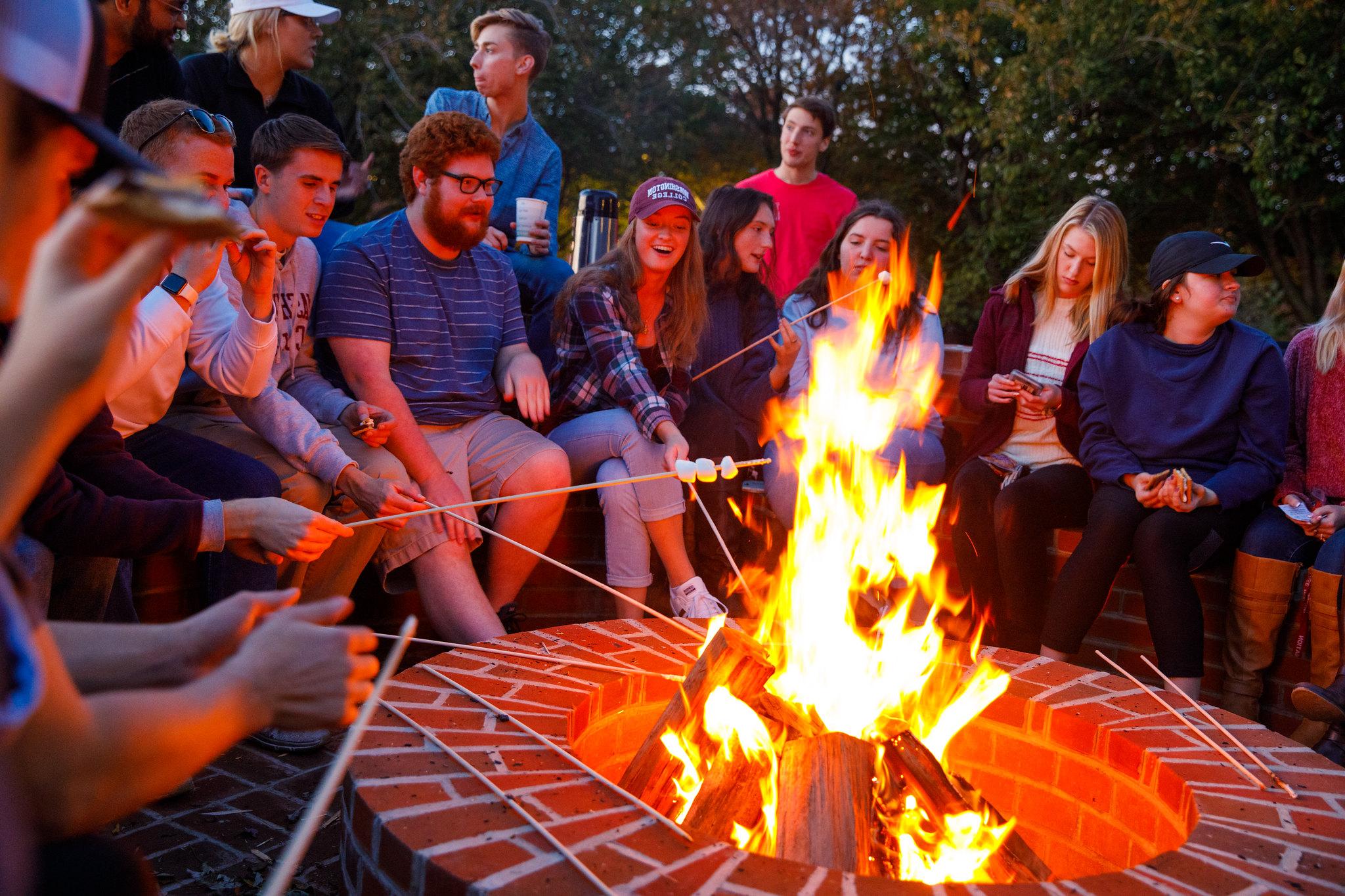 students roasting marshmellows
